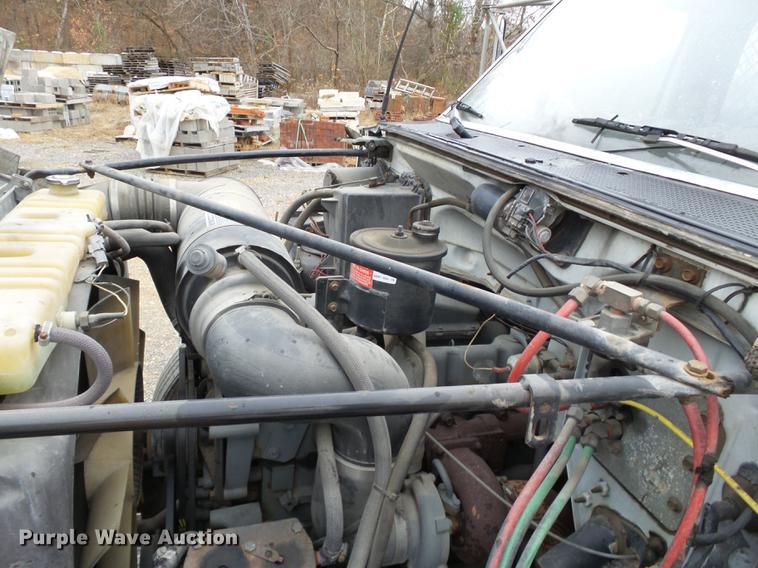 image for item DD2406 1990 Ford FT900 flatbed truck