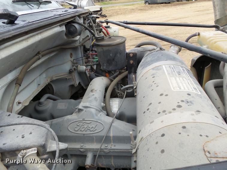 image for item DD2406 1990 Ford FT900 flatbed truck