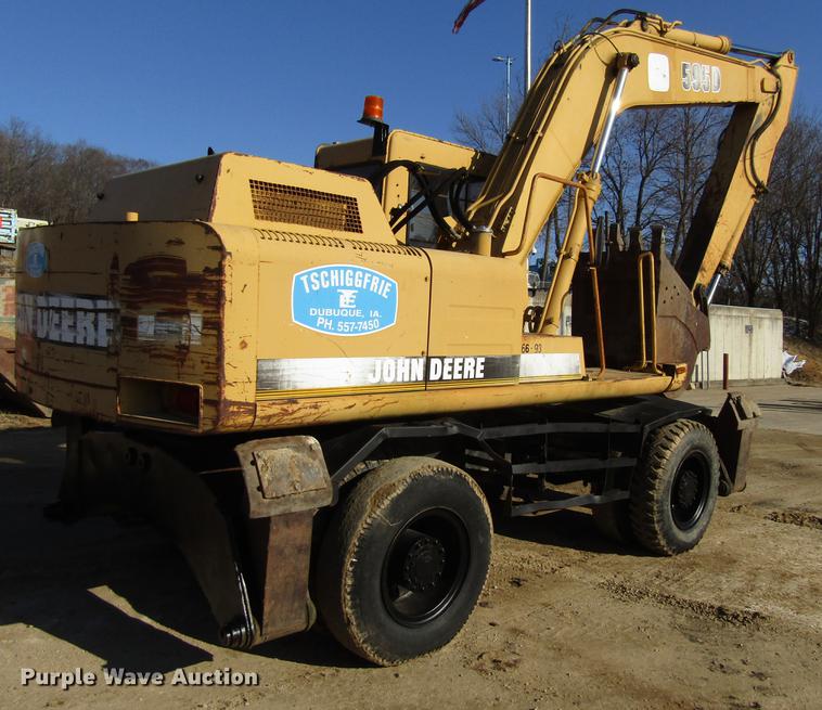 image for item DF3901 1993 John Deere 595D rubber tire excavator