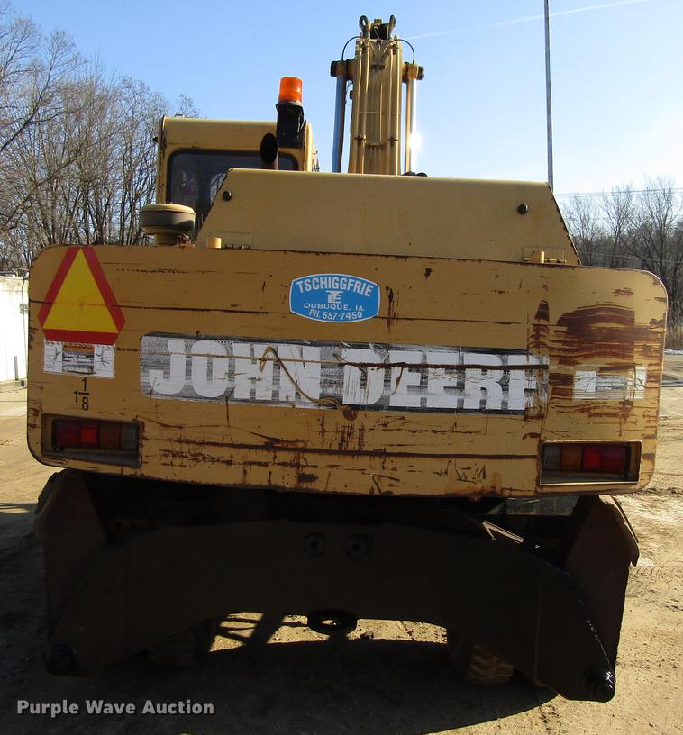 image for item DF3901 1993 John Deere 595D rubber tire excavator