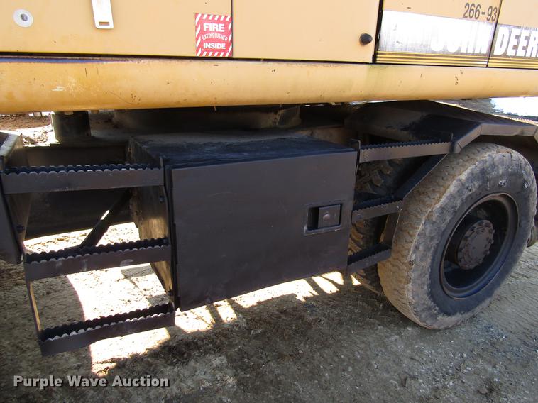 image for item DF3901 1993 John Deere 595D rubber tire excavator