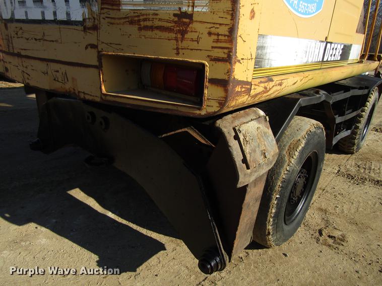 image for item DF3901 1993 John Deere 595D rubber tire excavator