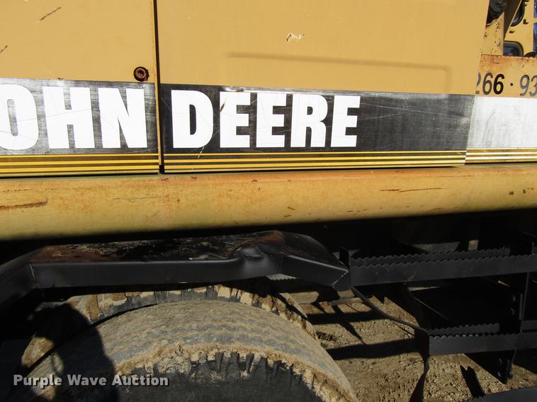 image for item DF3901 1993 John Deere 595D rubber tire excavator