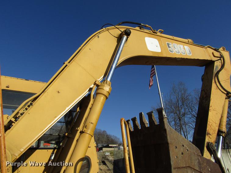 image for item DF3901 1993 John Deere 595D rubber tire excavator