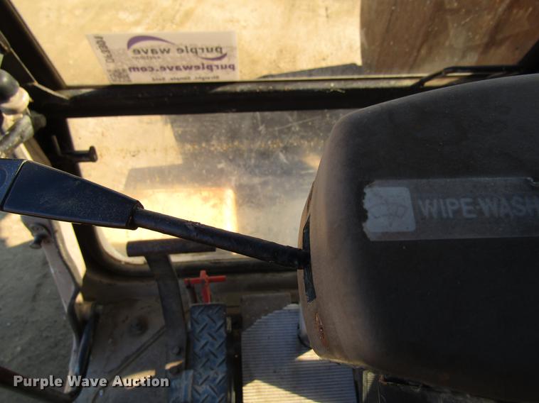 image for item DF3901 1993 John Deere 595D rubber tire excavator