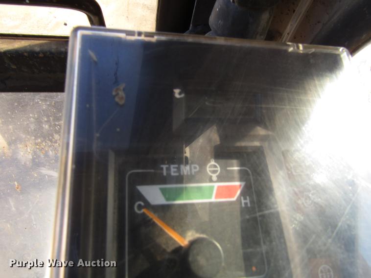 image for item DF3901 1993 John Deere 595D rubber tire excavator