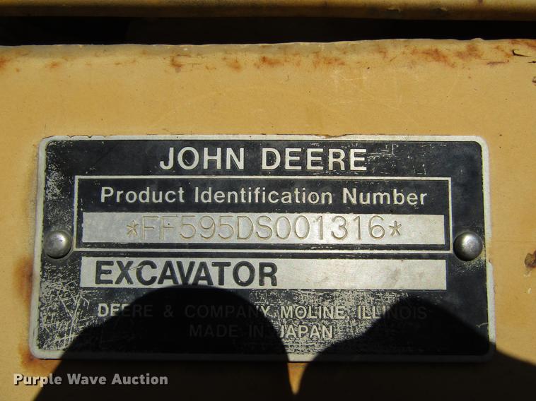 image for item DF3901 1993 John Deere 595D rubber tire excavator