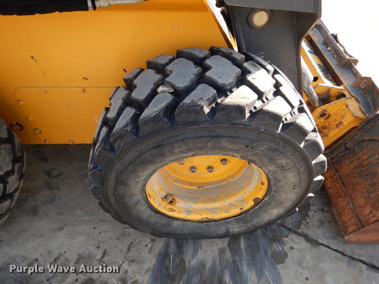 image for item DX9460 2014 John Deere 332E skid steer