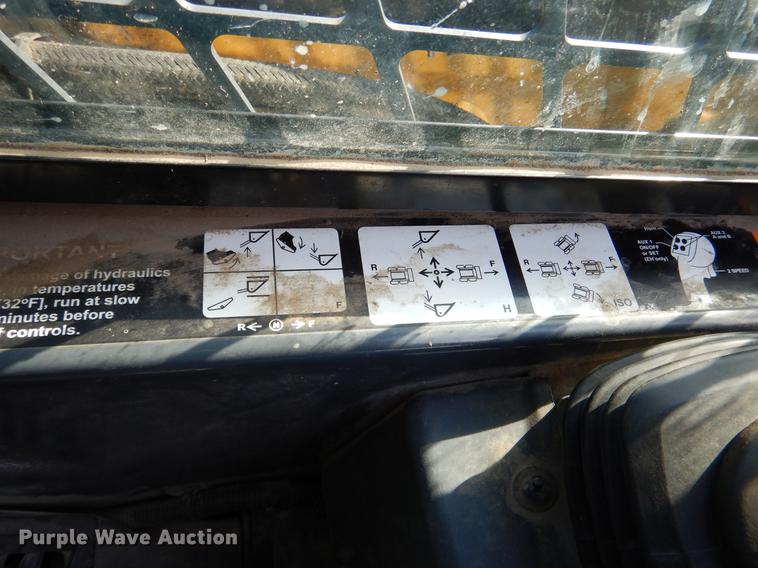 image for item DX9460 2014 John Deere 332E skid steer