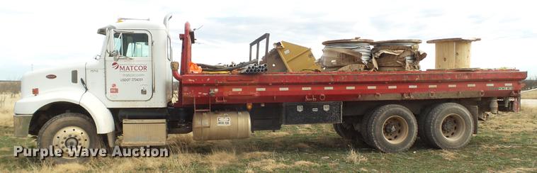 image for item EI9723 2002 Peterbilt 330 flatbed water truck