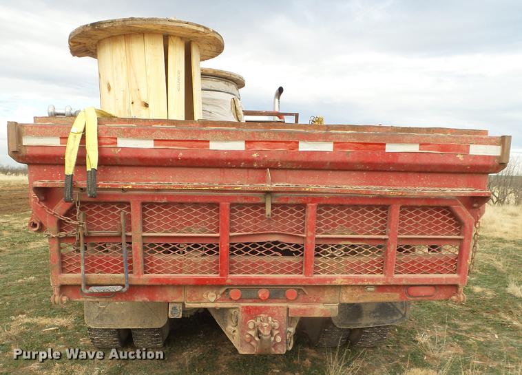 image for item EI9723 2002 Peterbilt 330 flatbed water truck