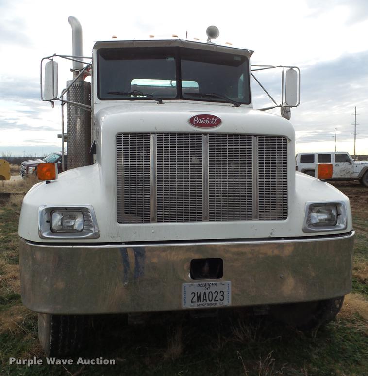 image for item EI9723 2002 Peterbilt 330 flatbed water truck