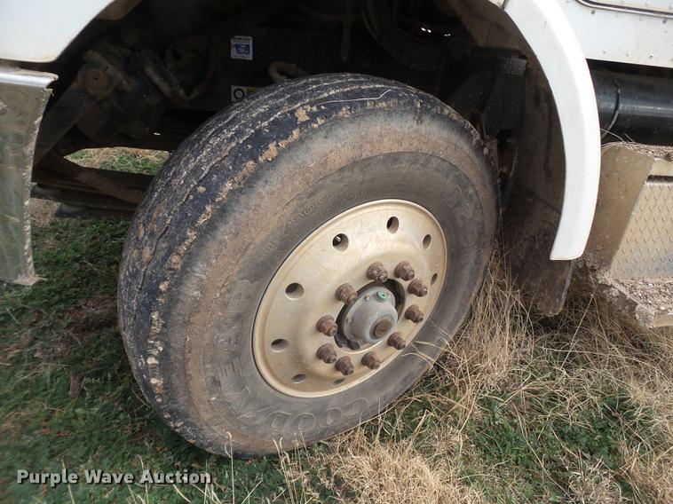 image for item EI9723 2002 Peterbilt 330 flatbed water truck