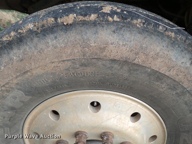 image for item EI9723 2002 Peterbilt 330 flatbed water truck