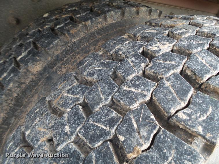 image for item EI9723 2002 Peterbilt 330 flatbed water truck