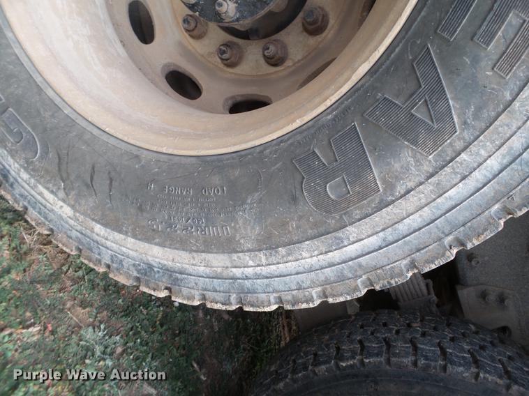 image for item EI9723 2002 Peterbilt 330 flatbed water truck