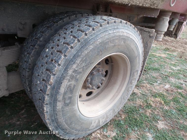 image for item EI9723 2002 Peterbilt 330 flatbed water truck