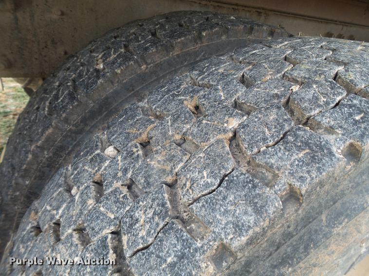 image for item EI9723 2002 Peterbilt 330 flatbed water truck