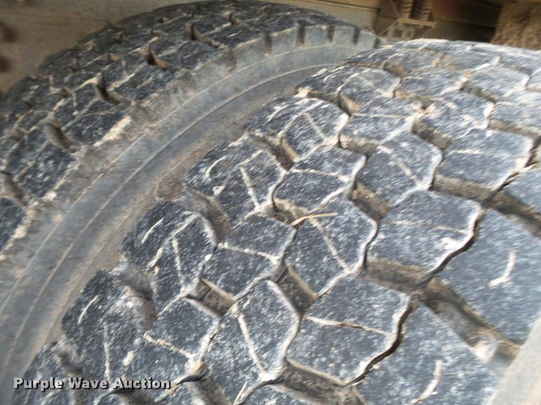 image for item EI9723 2002 Peterbilt 330 flatbed water truck