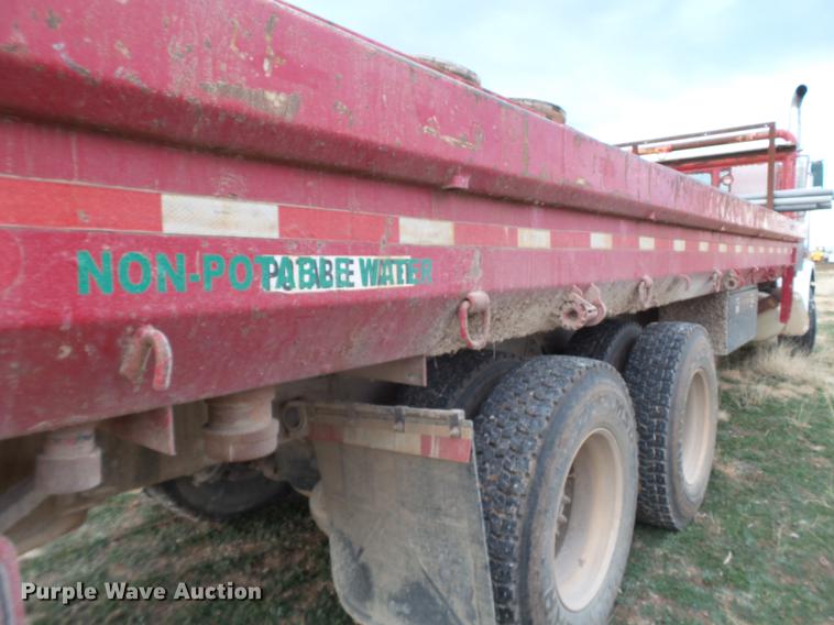 image for item EI9723 2002 Peterbilt 330 flatbed water truck