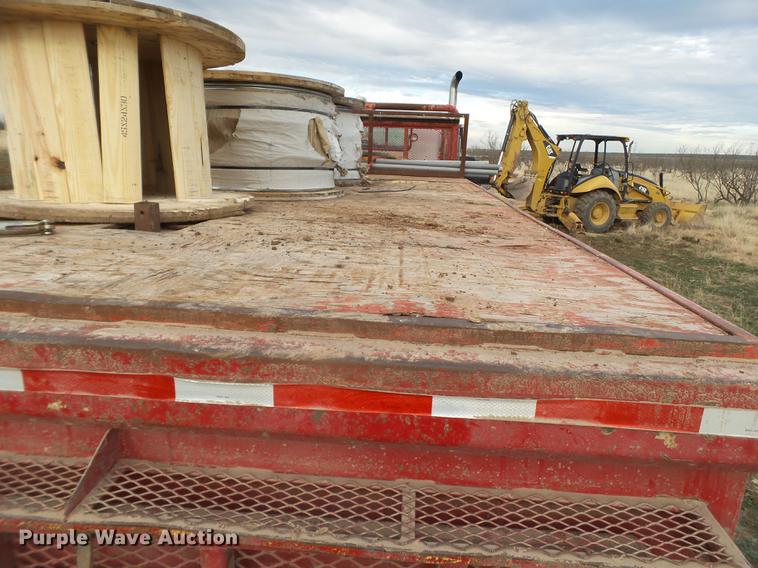 image for item EI9723 2002 Peterbilt 330 flatbed water truck