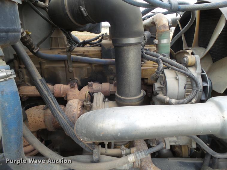 image for item EI9723 2002 Peterbilt 330 flatbed water truck