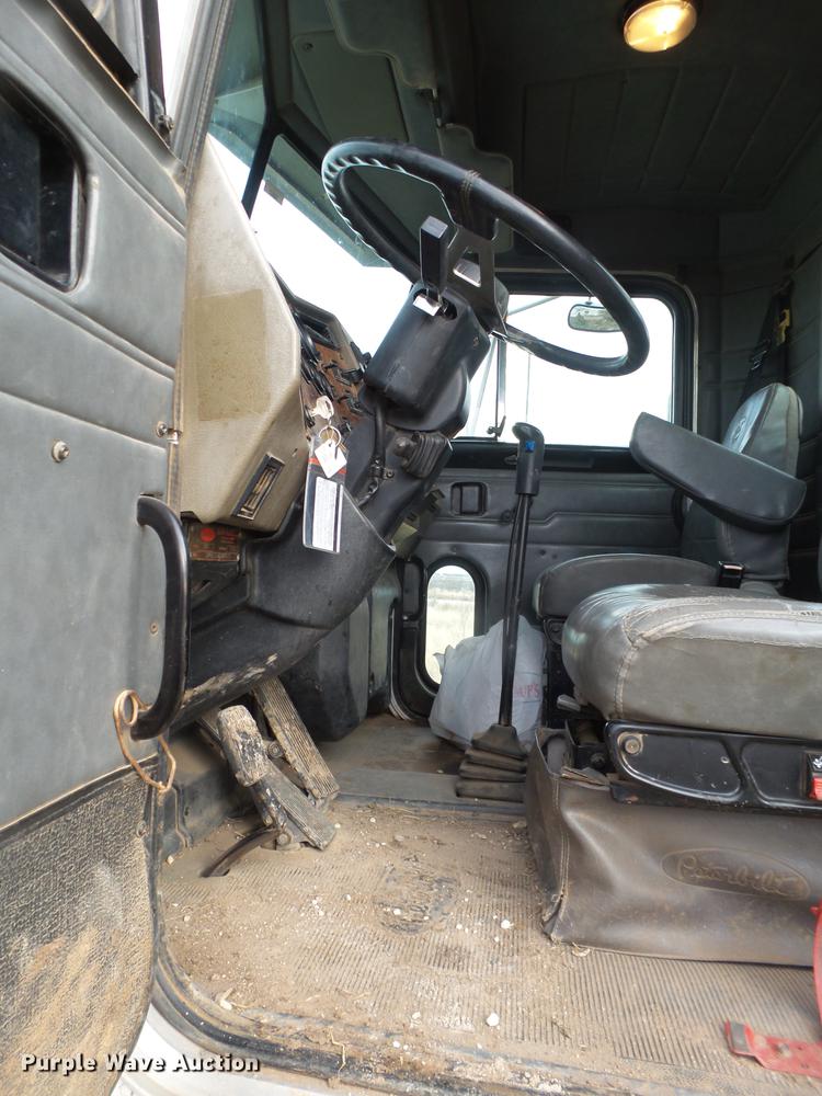 image for item EI9723 2002 Peterbilt 330 flatbed water truck