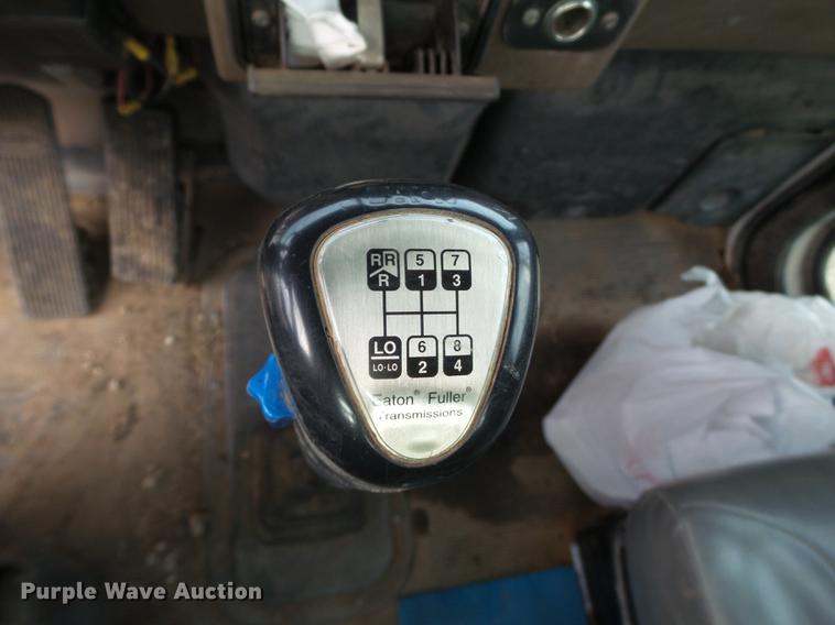 image for item EI9723 2002 Peterbilt 330 flatbed water truck