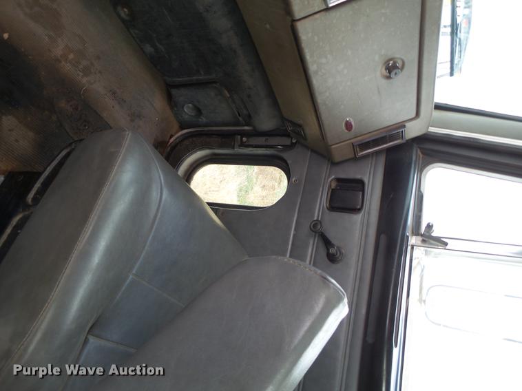 image for item EI9723 2002 Peterbilt 330 flatbed water truck