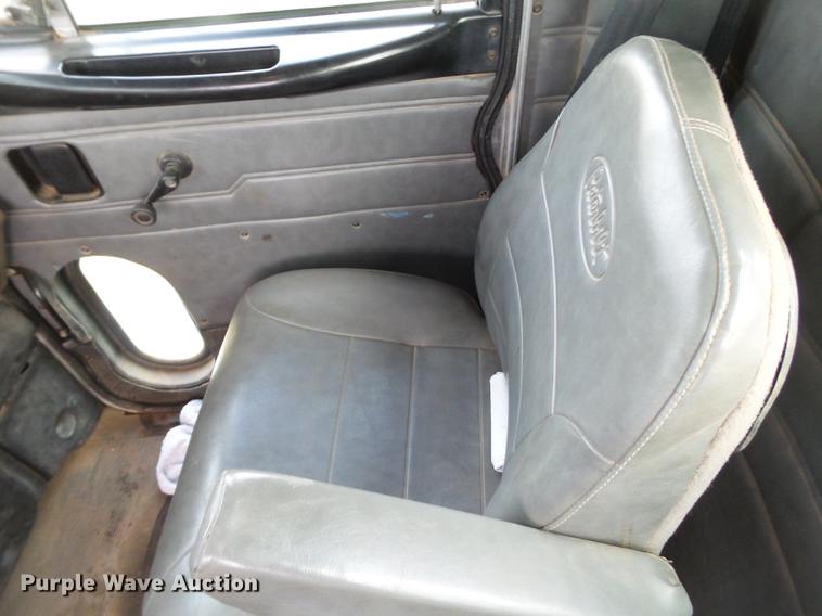 image for item EI9723 2002 Peterbilt 330 flatbed water truck