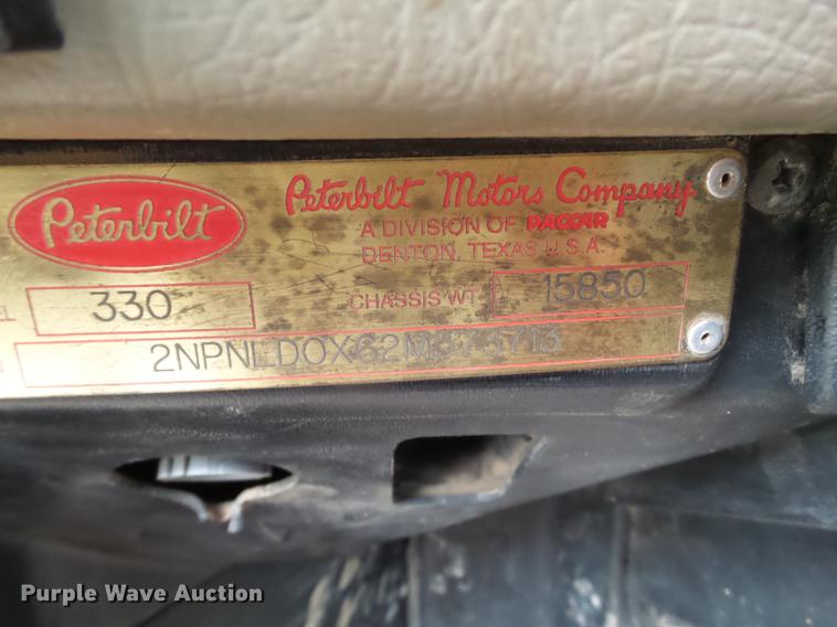 image for item EI9723 2002 Peterbilt 330 flatbed water truck