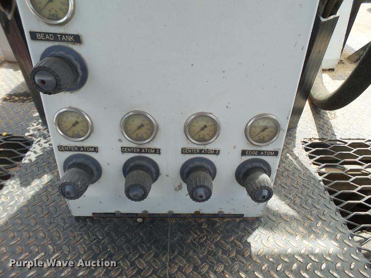 image for item EN9620 1999 GMC T6500 road striper truck