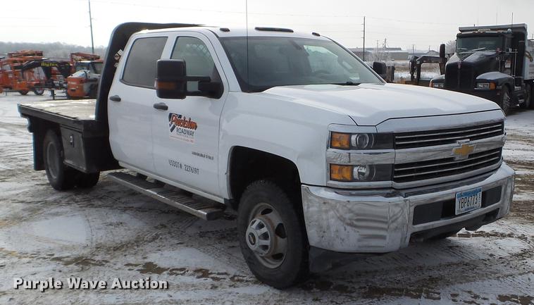 image for item DD0720 2015 Chevrolet Silverado 3500 Crew Cab flatbed pickup truck