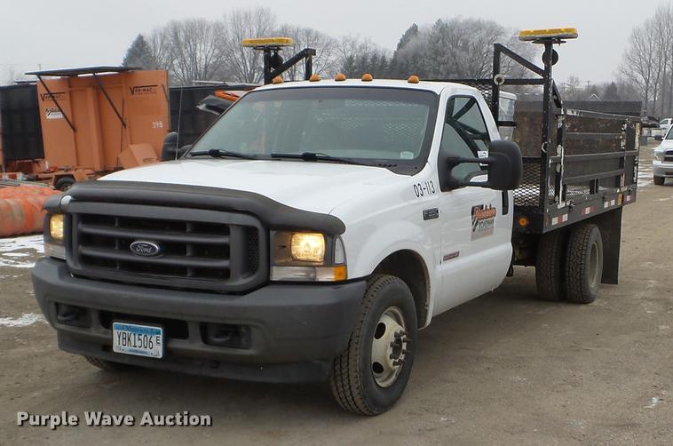image for item DD0729 2004 Ford F350 Super Duty flatbed pickup truck