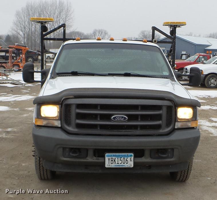 image for item DD0729 2004 Ford F350 Super Duty flatbed pickup truck