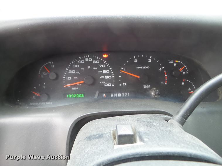 image for item DD0729 2004 Ford F350 Super Duty flatbed pickup truck