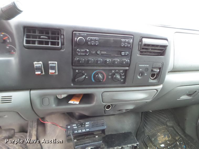 image for item DD0729 2004 Ford F350 Super Duty flatbed pickup truck