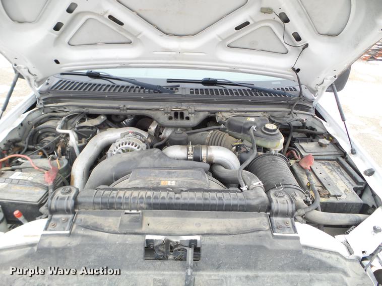 image for item DD0729 2004 Ford F350 Super Duty flatbed pickup truck