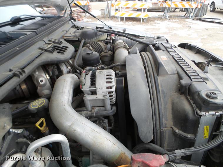 image for item DD0729 2004 Ford F350 Super Duty flatbed pickup truck