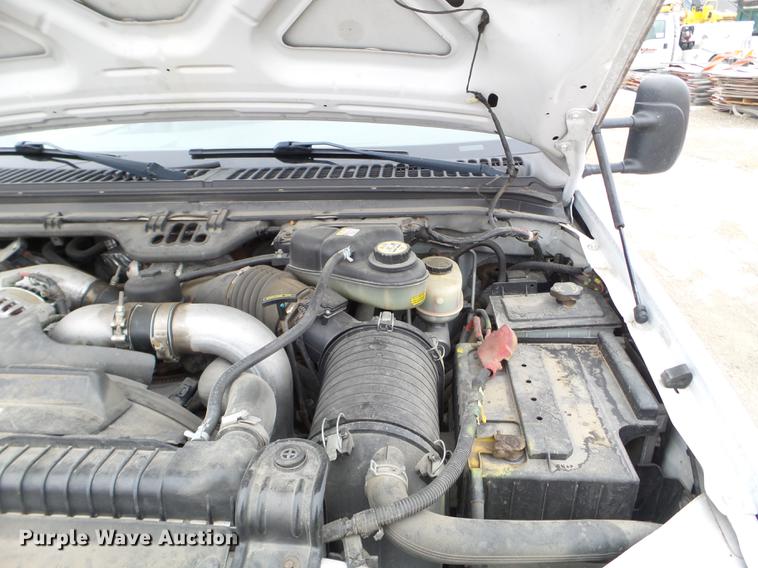 image for item DD0729 2004 Ford F350 Super Duty flatbed pickup truck