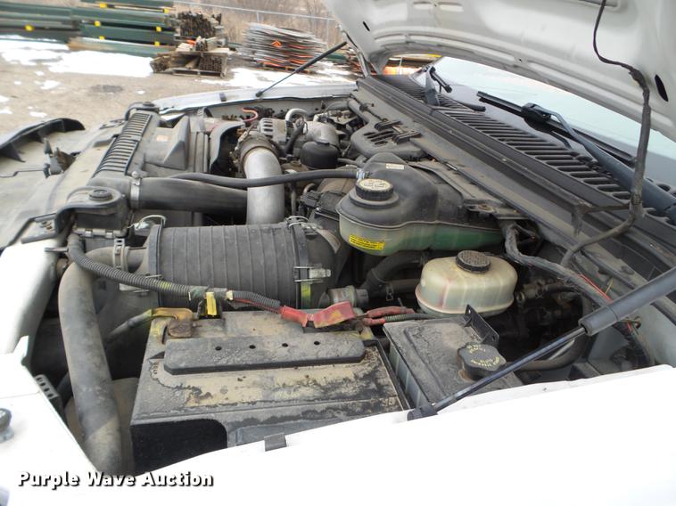 image for item DD0729 2004 Ford F350 Super Duty flatbed pickup truck