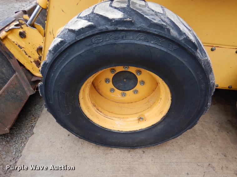 image for item BE9311 2000 John Deere 260 skid steer