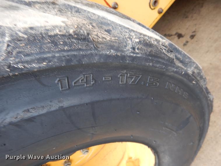 image for item BE9311 2000 John Deere 260 skid steer