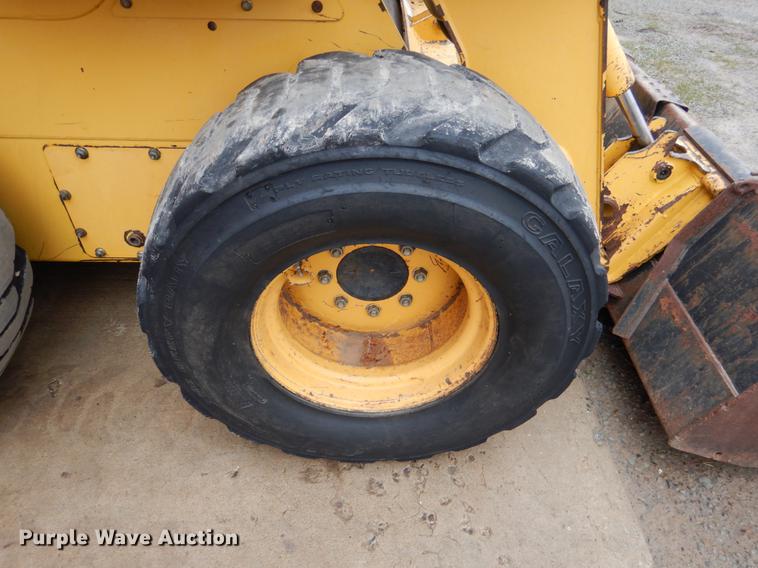 image for item BE9311 2000 John Deere 260 skid steer