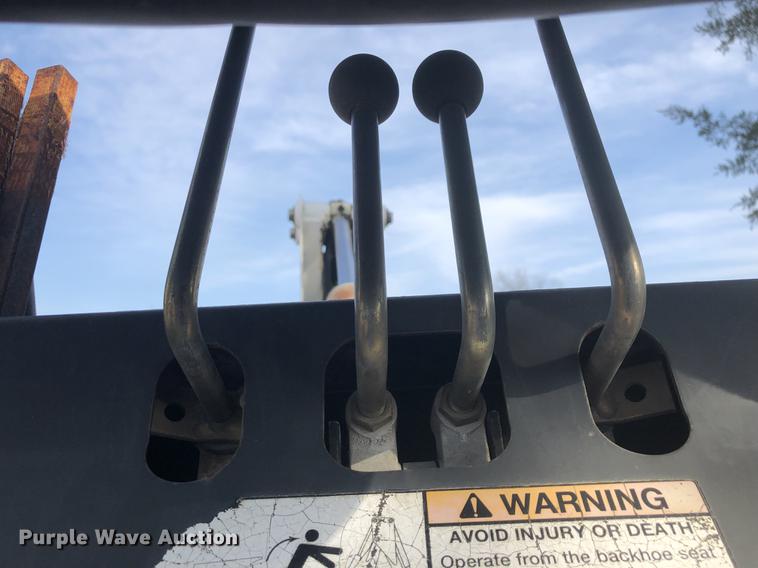 image for item DC0185 Melroe 709 skid steer backhoe attachment