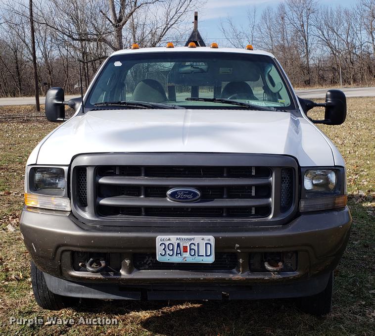 image for item EN9755 2003 Ford F550 roll-off container truck