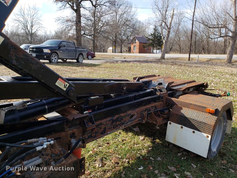 image for item EN9755 2003 Ford F550 roll-off container truck