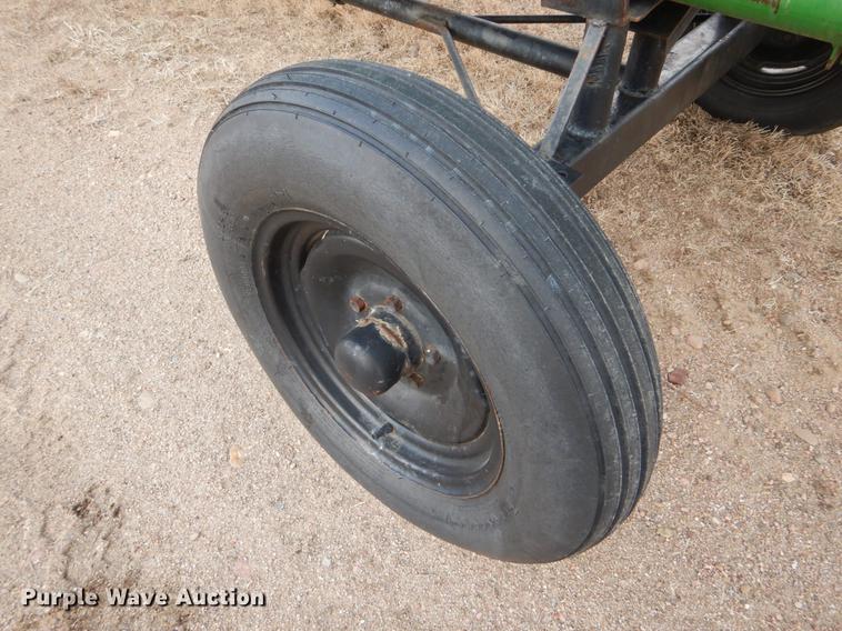 image for item FH9015 1990 John Deere 930 rigid head and trailer