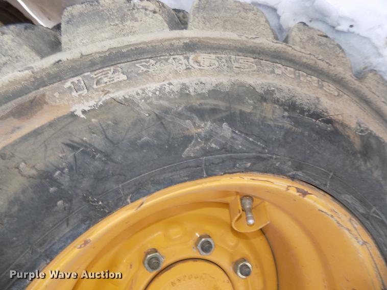 image for item DE7595 2005 John Deere 320 skid steer