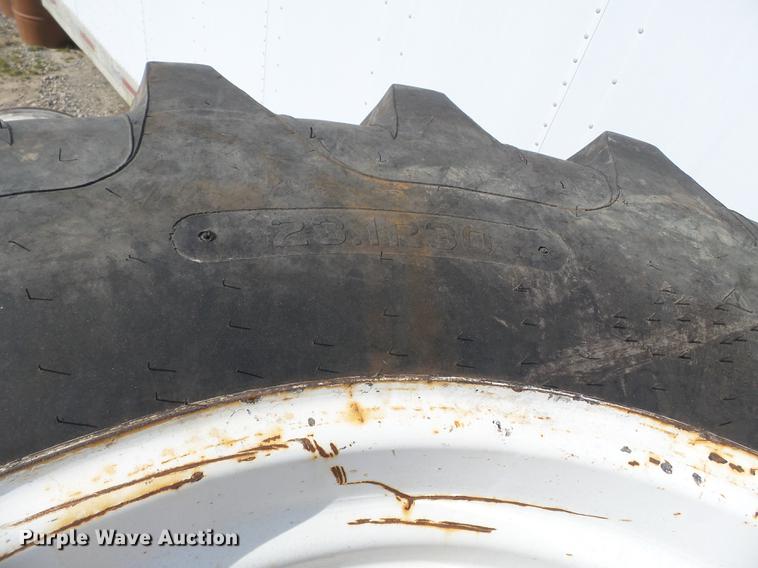 image for item CD9585 (4) Titan 23.1R30 tires and wheels